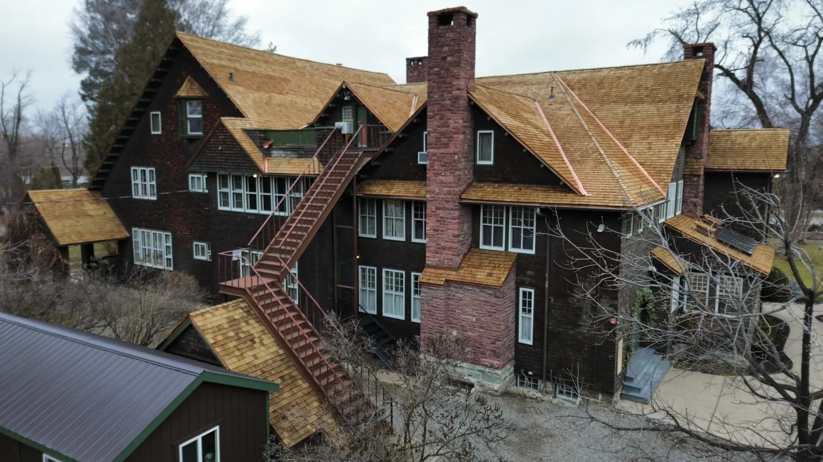 Rear elevation of a home with a cedar shingle roof